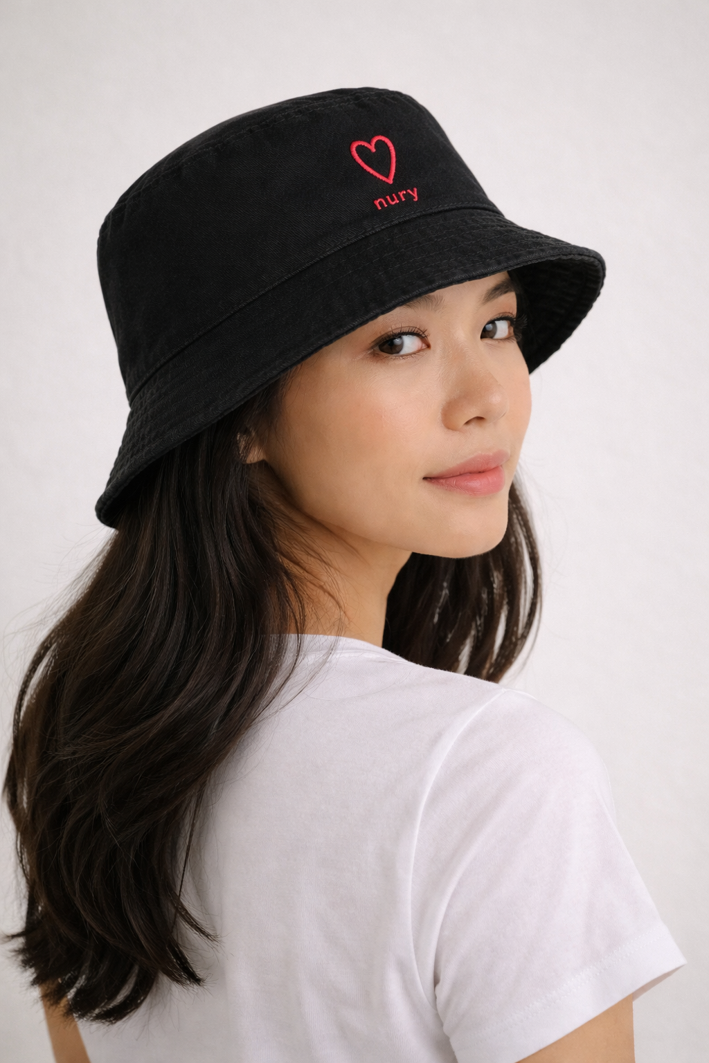 Model wearing a nury bucket hat