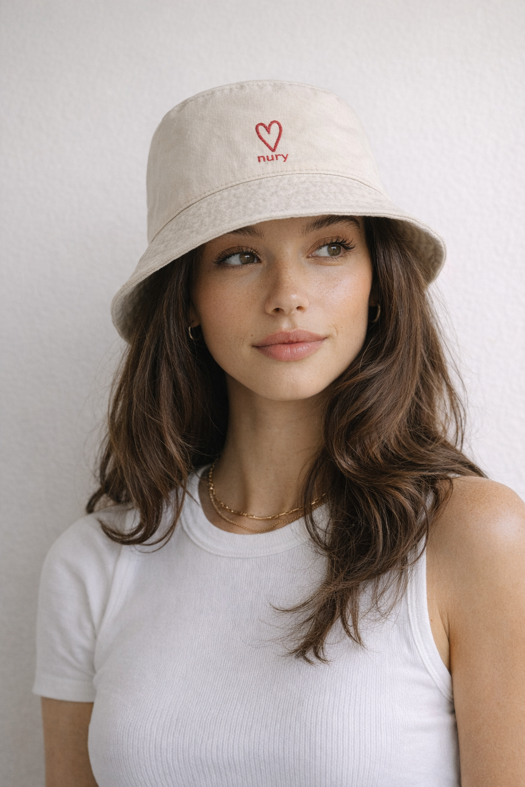 Model wearing a nury bucket hat